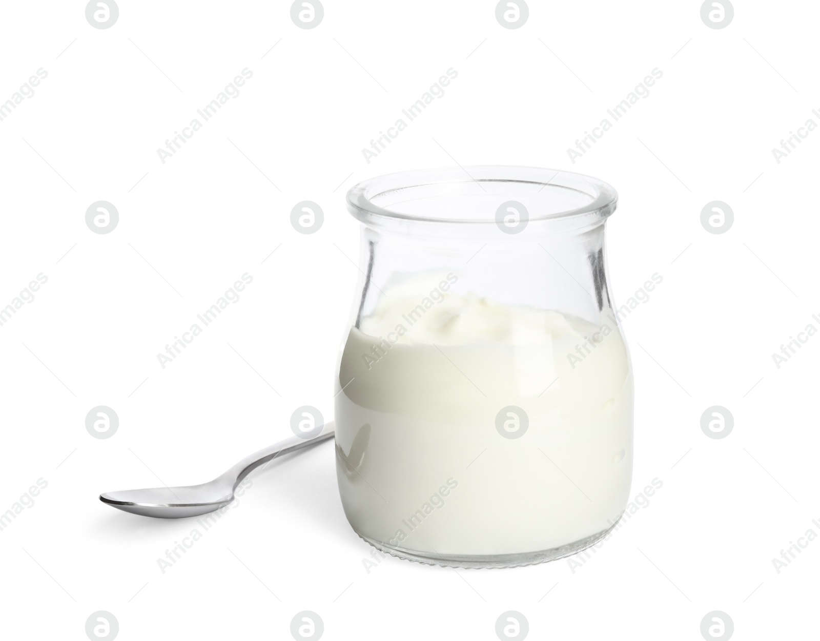 Photo of Tasty organic yogurt in glass jar and spoon isolated on white