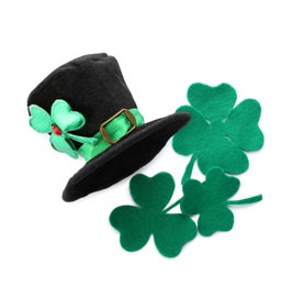 Leprechaun's hat and decorative clover leaves on white background, top view. St. Patrick's day celebration
