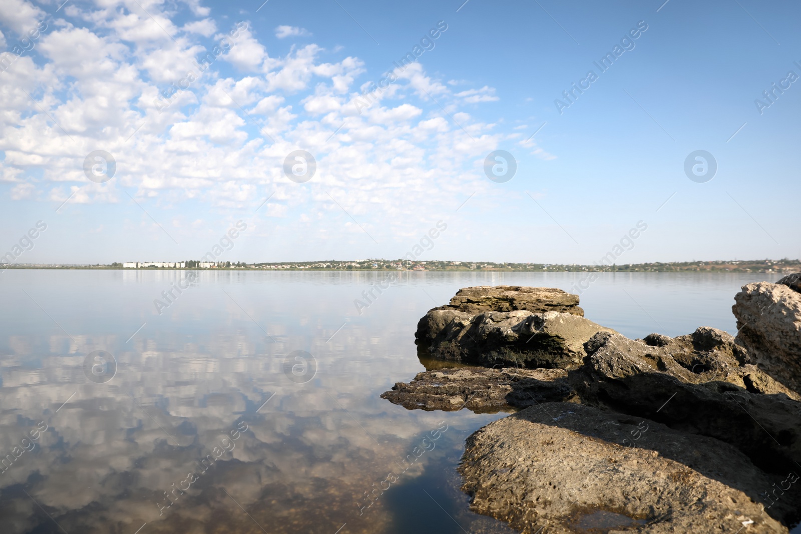 Photo of Beautiful view of tranquil sea and rocks on sunny day. Nature healing concept