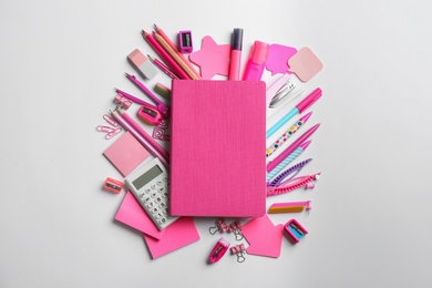 Photo of Notebook and school stationery on white background, flat lay with space for text. Back to school