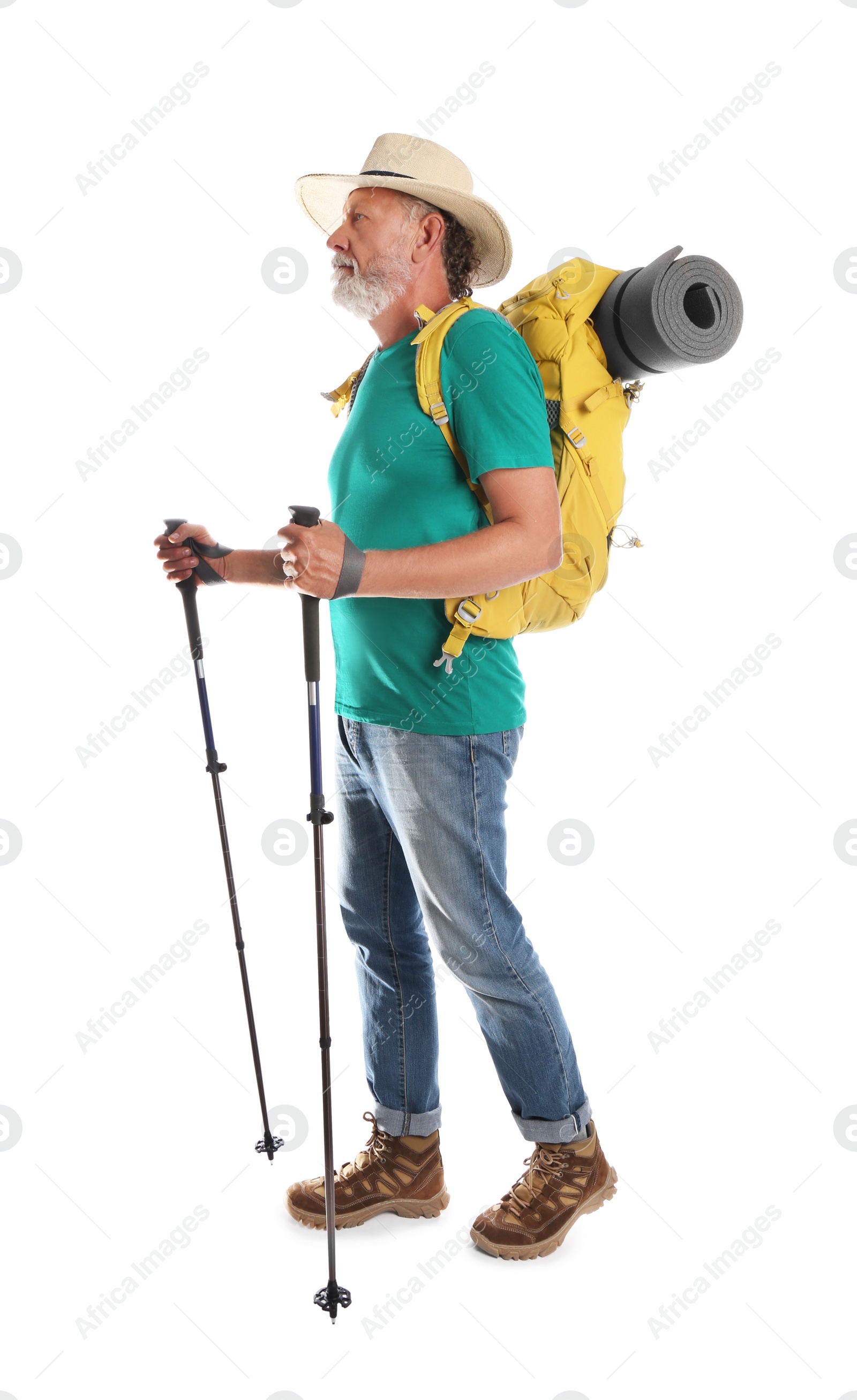 Photo of Male hiker with backpack and trekking poles on white background