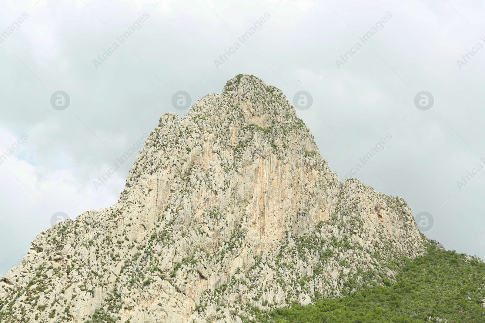 Photo of Picturesque landscape with high mountains and fog under gloomy sky