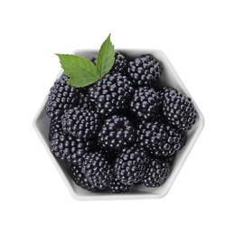 Photo of Ceramic bowl of tasty ripe blackberries with leaves on white background, top view