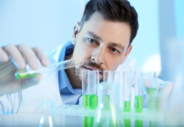 Male scientist working with sample in chemistry laboratory