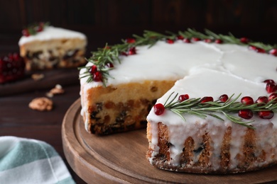 Traditional homemade Christmas cake on wooden table, closeup