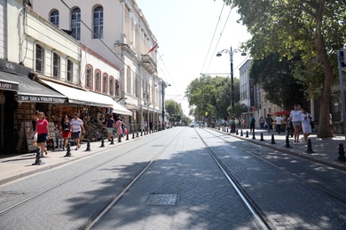 Photo of ISTANBUL, TURKEY - AUGUST 10, 2019: Beautiful city street with people on sunny day