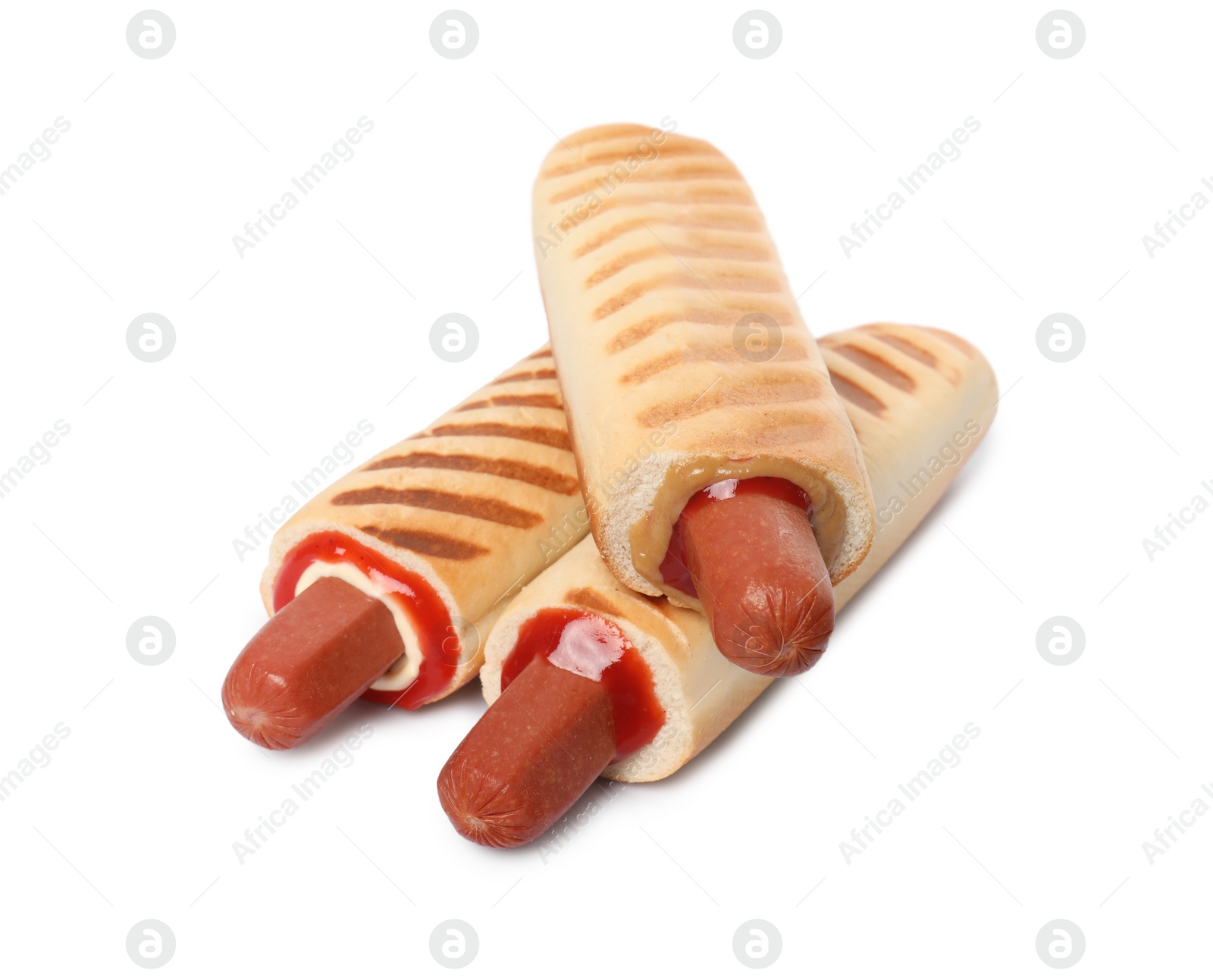 Photo of Tasty french hot dogs with different sauces on white background