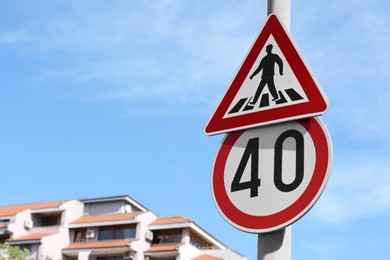 Post with different road signs outdoors on sunny day