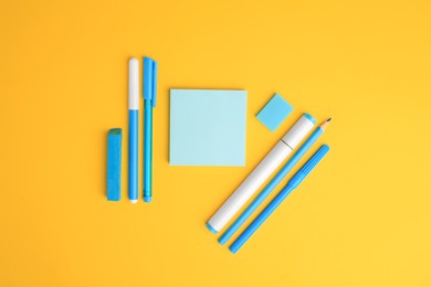 Photo of Flat lay composition with different school stationery on yellow background, space for text. Back to school