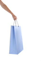 Woman with paper shopping bag on white background, closeup