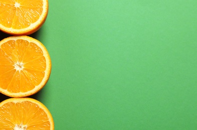 Photo of Flat lay composition with ripe oranges and space for text on color background