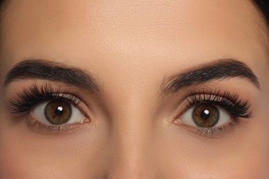 Photo of Beautiful young woman with long eyelashes, closeup