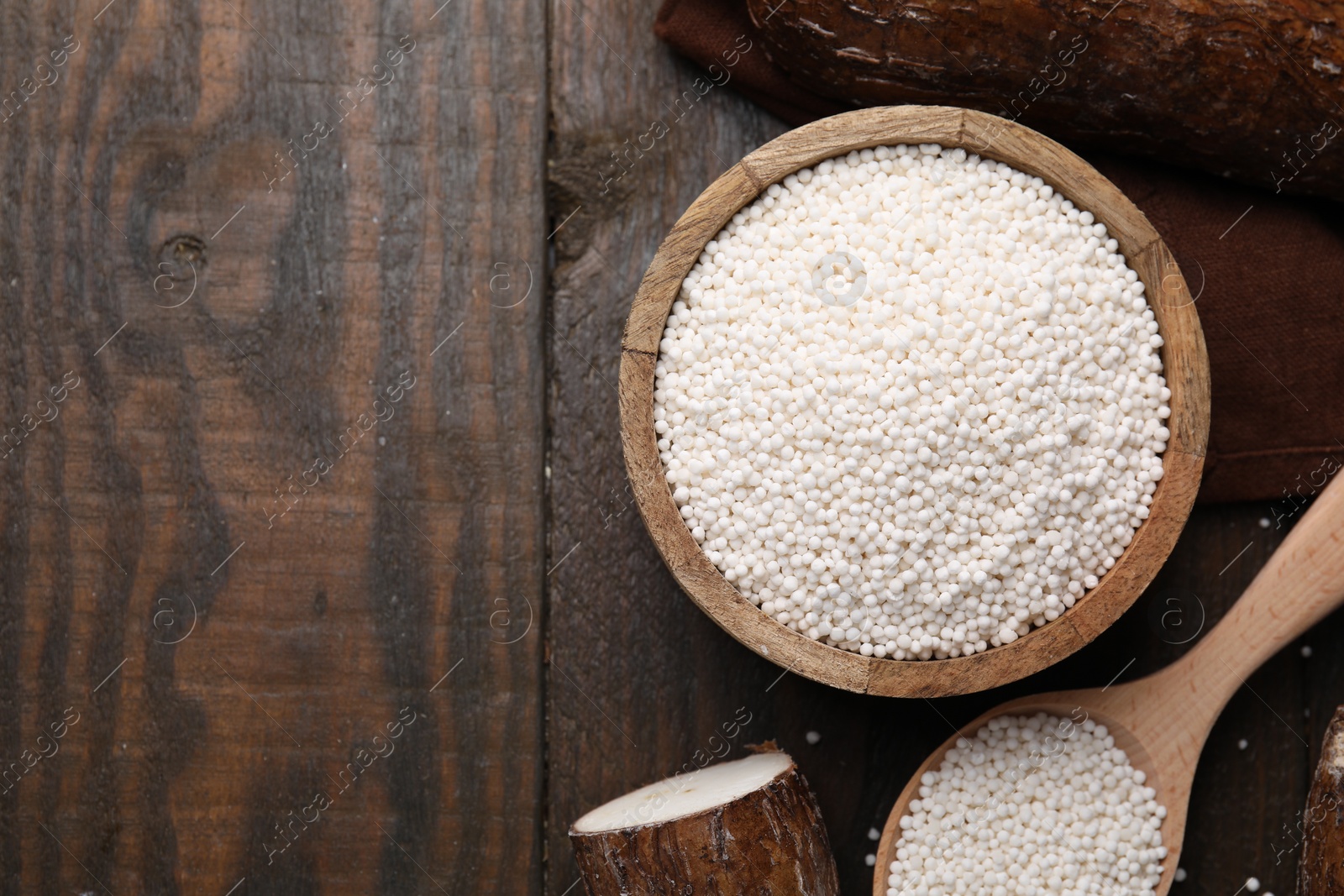 Photo of Flat lay composition with tapioca pearls on wooden table. Space for text