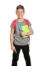 Cute boy with school stationery on white background