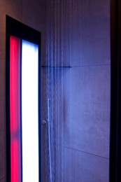 Photo of Modern shower with Infrared spectrum, UV light and flowing water
