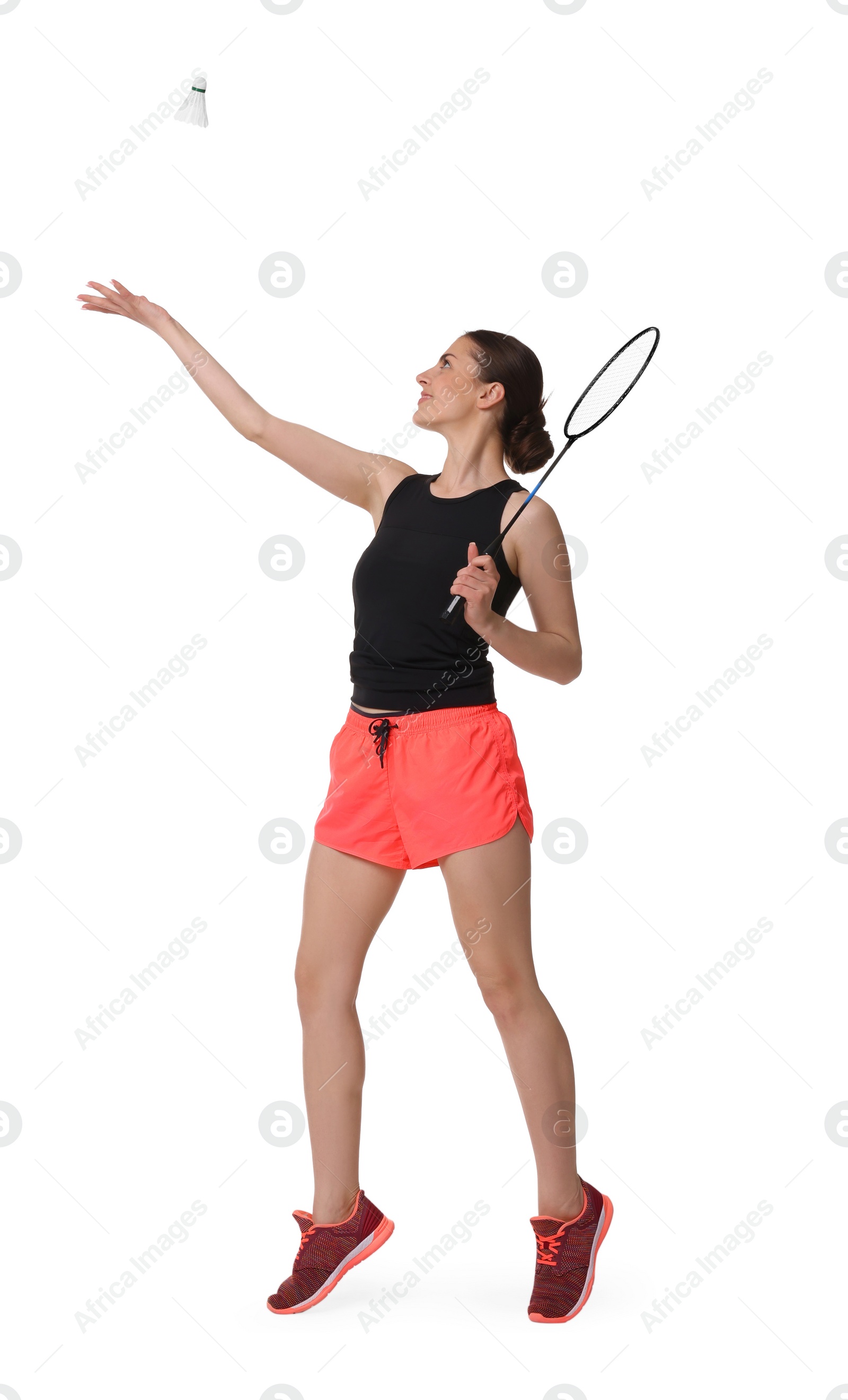 Photo of Young woman playing badminton with racket and shuttlecock on white background