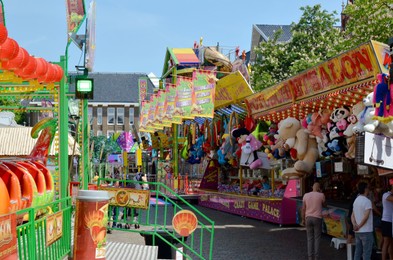 Netherlands, Groningen - May 18, 2022: Beautiful stalls with different toys in amusement park