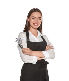 Photo of Portrait of happy hairdresser with professional scissors on white background