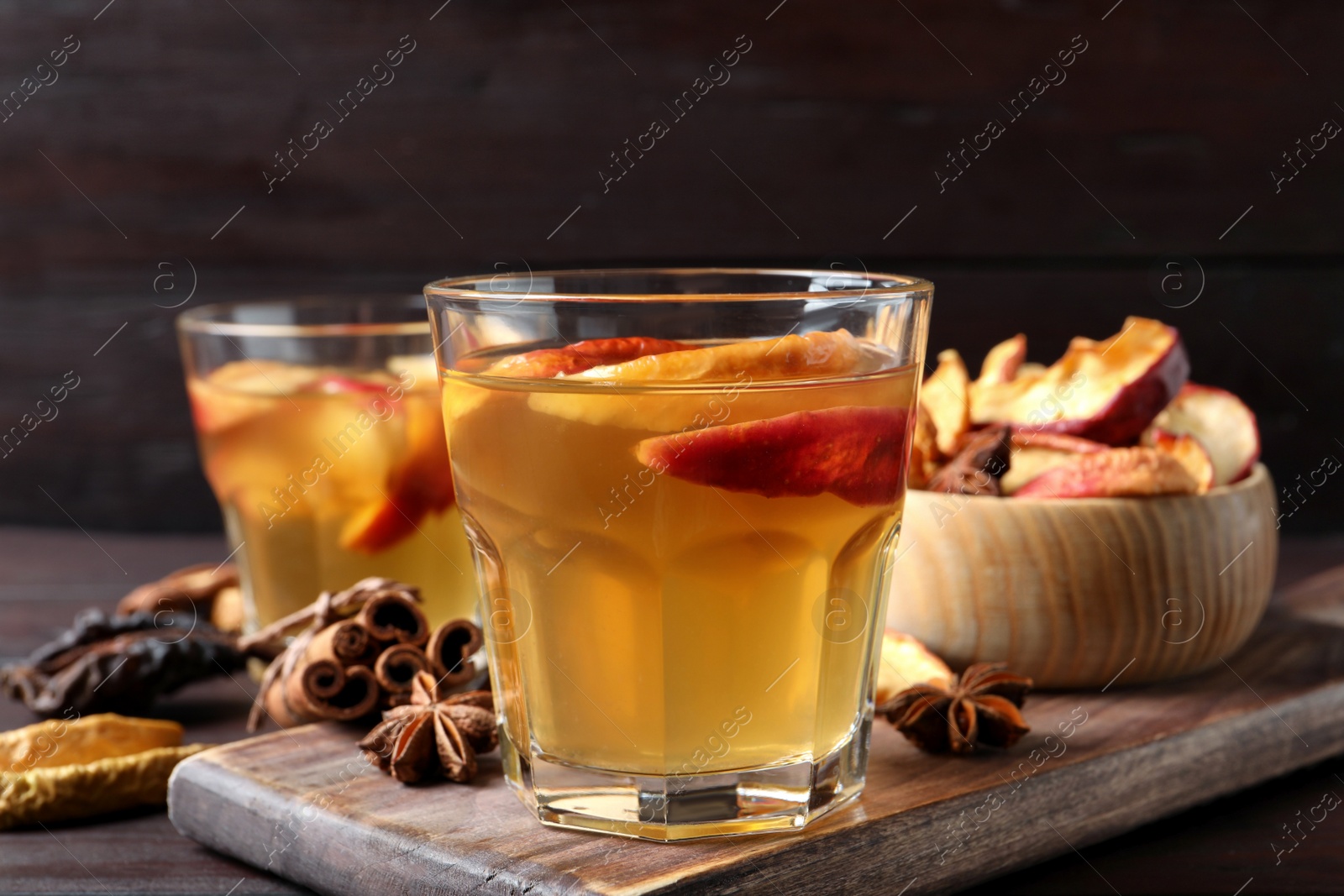 Photo of Delicious compote and ingredients on wooden table, closeup