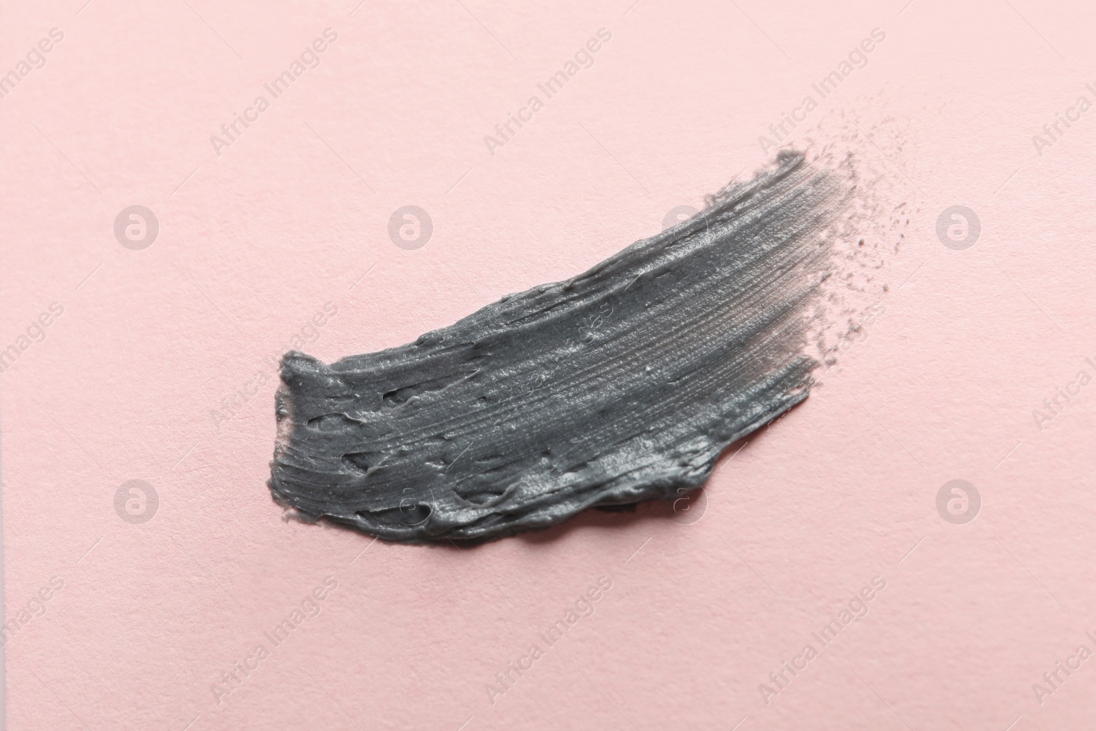 Photo of Sample of face mask on pink background, top view