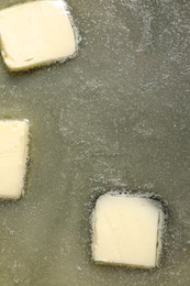 Photo of Tasty melting butter, top view. Dairy product