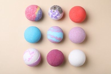 Photo of Colorful bath bombs on light background, flat lay