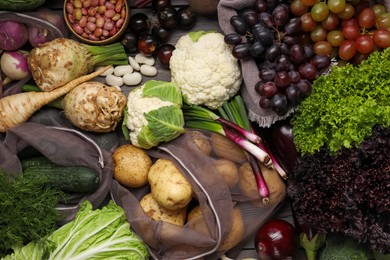 Photo of Different fresh ripe vegetables and fruits on wooden table, flat lay