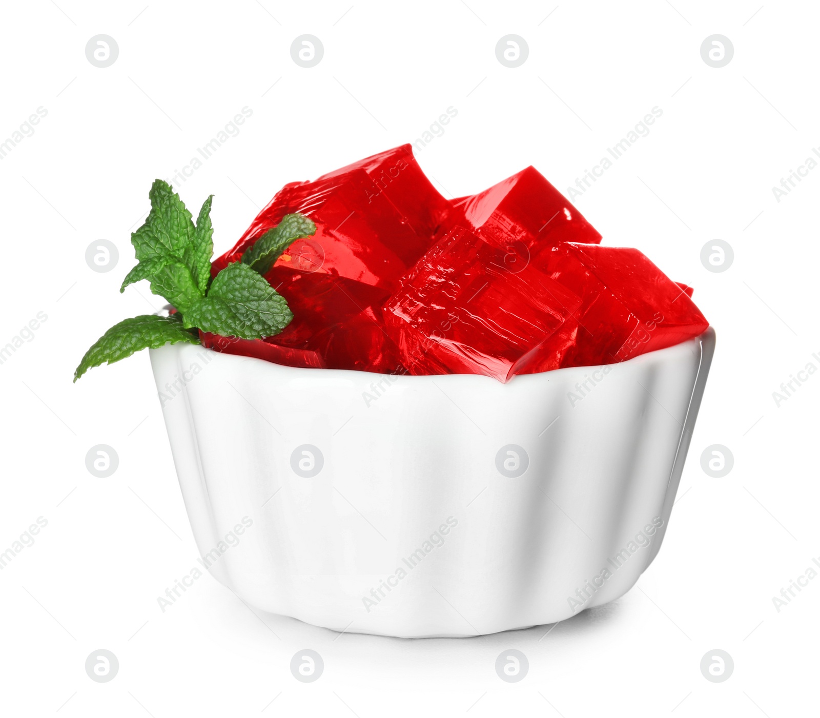 Photo of Bowl with red jelly cubes on white background