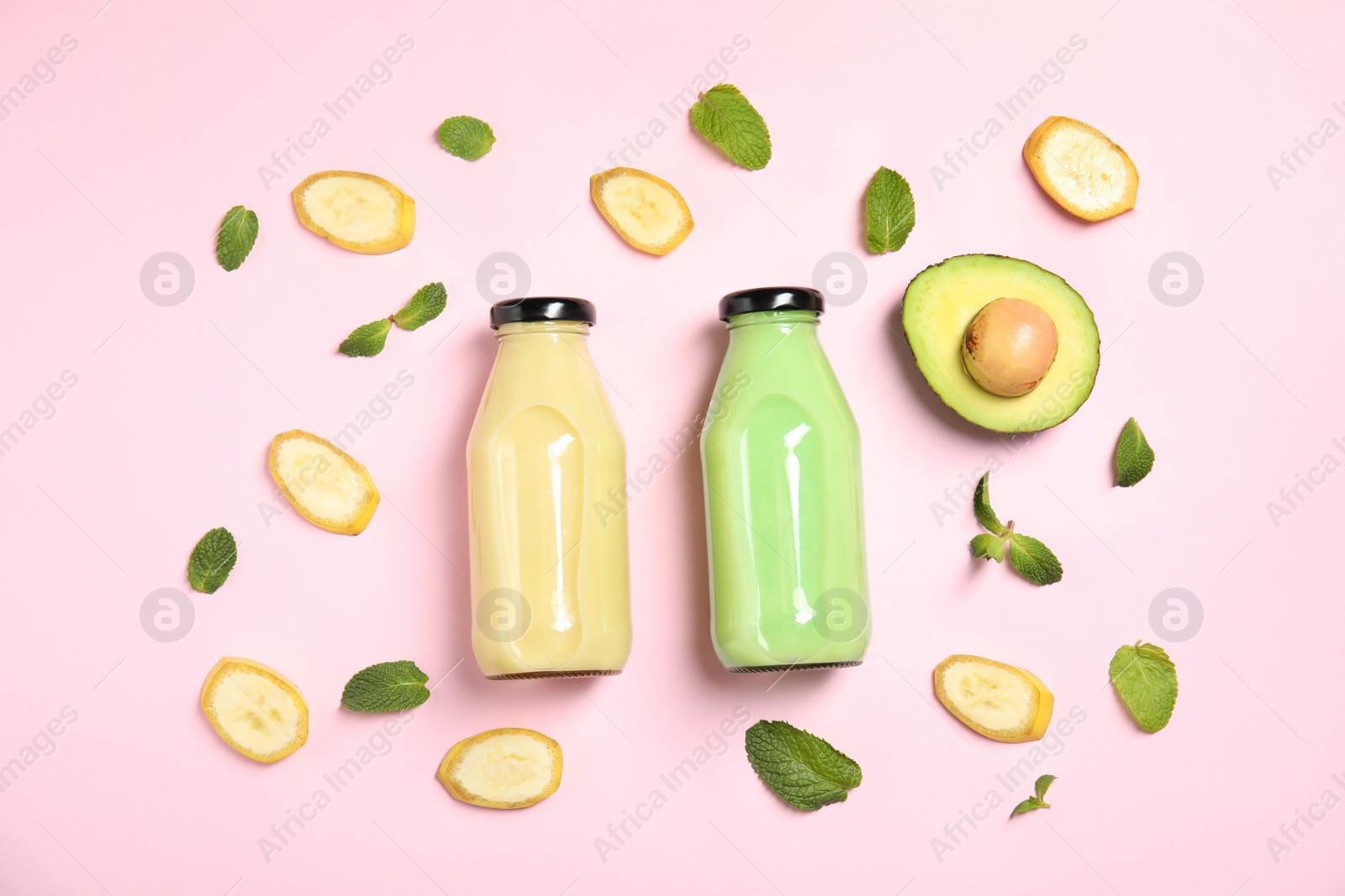 Photo of Flat lay composition with different smoothies in bottles and ingredients on color background