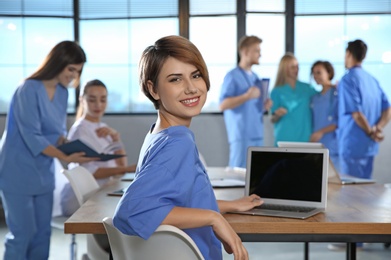 Smart medical student with her classmates in college