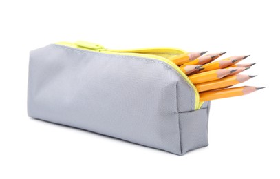 Photo of Many sharp pencils in pencil case on white background