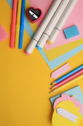 Photo of Different school stationery on yellow background, flat lay with space for text. Back to school