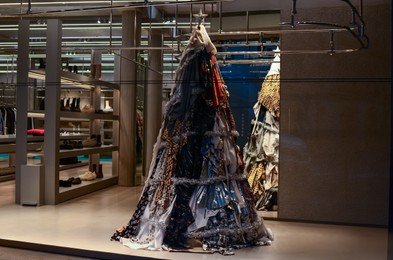 Paris, France - December 10, 2022: Christmas tree made of clothes in Balenciaga store