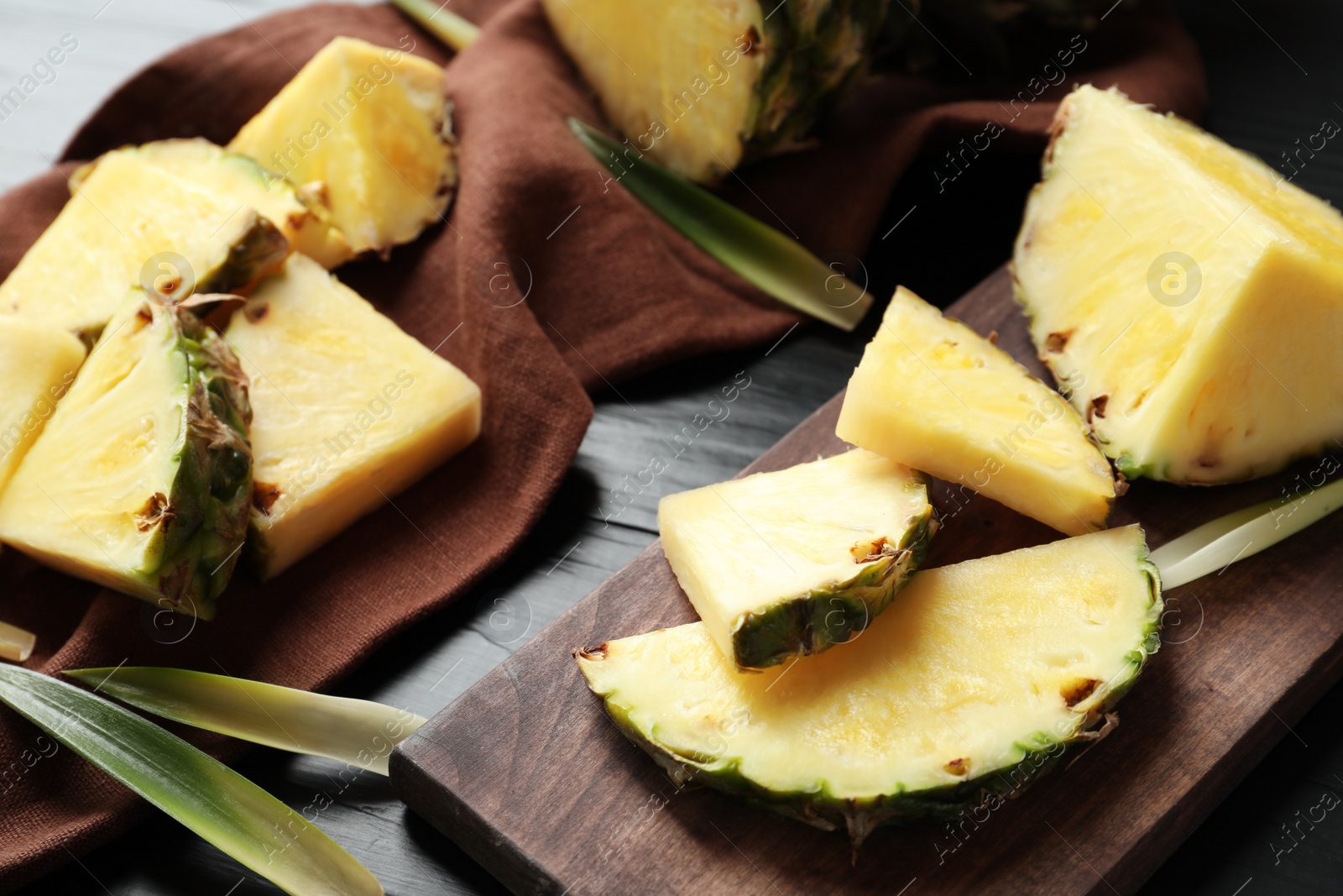 Photo of Composition with fresh sliced pineapple on table