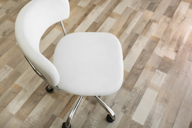 Comfortable office chair on floor in room