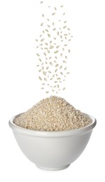 Sesame seeds falling into bowl on white background 