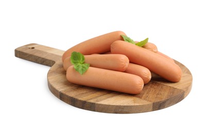 Delicious boiled sausages and basil isolated on white