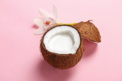 Photo of Nut with fresh coconut milk on color background