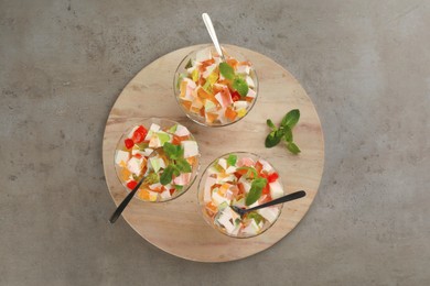 Delicious broken glass jelly dessert on grey table, top view