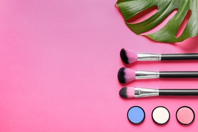 Photo of Flat lay composition with products for decorative makeup on pink background