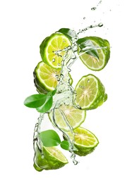 Fresh ripe bergamot fruits, green leaves and splashing water on white background