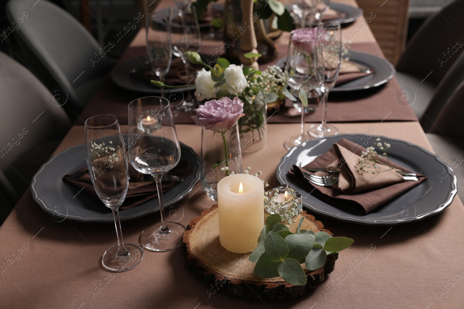 Photo of Elegant table setting with beautiful floral decor and burning candles