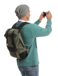 Photo of Man with backpack taking picture on white background. Autumn travel