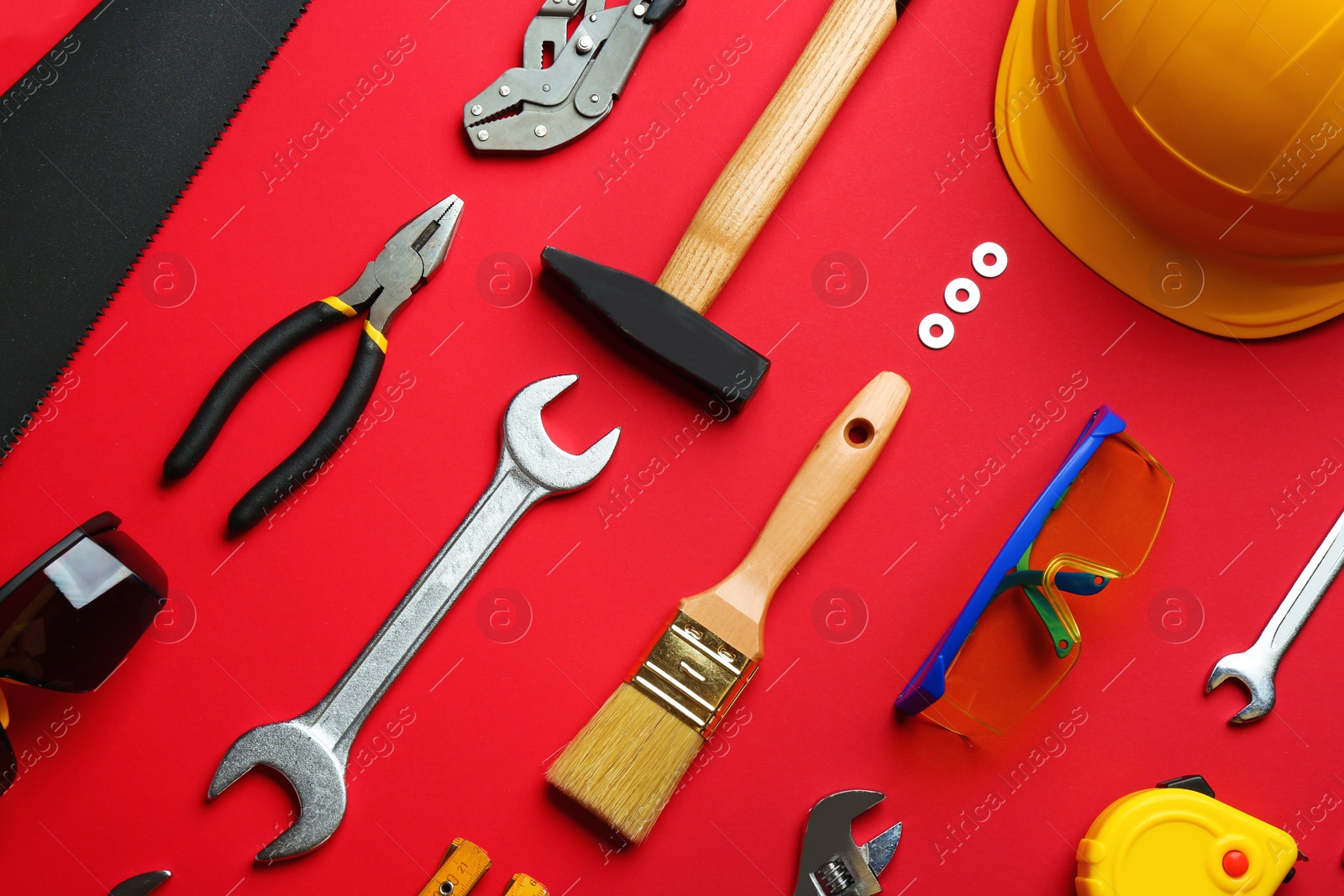 Photo of Flat lay composition with construction tools on color background