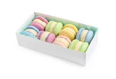 Photo of Many delicious colorful macarons in box on white background
