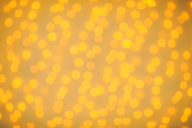 Photo of Beautiful gold lights as background. Bokeh effect