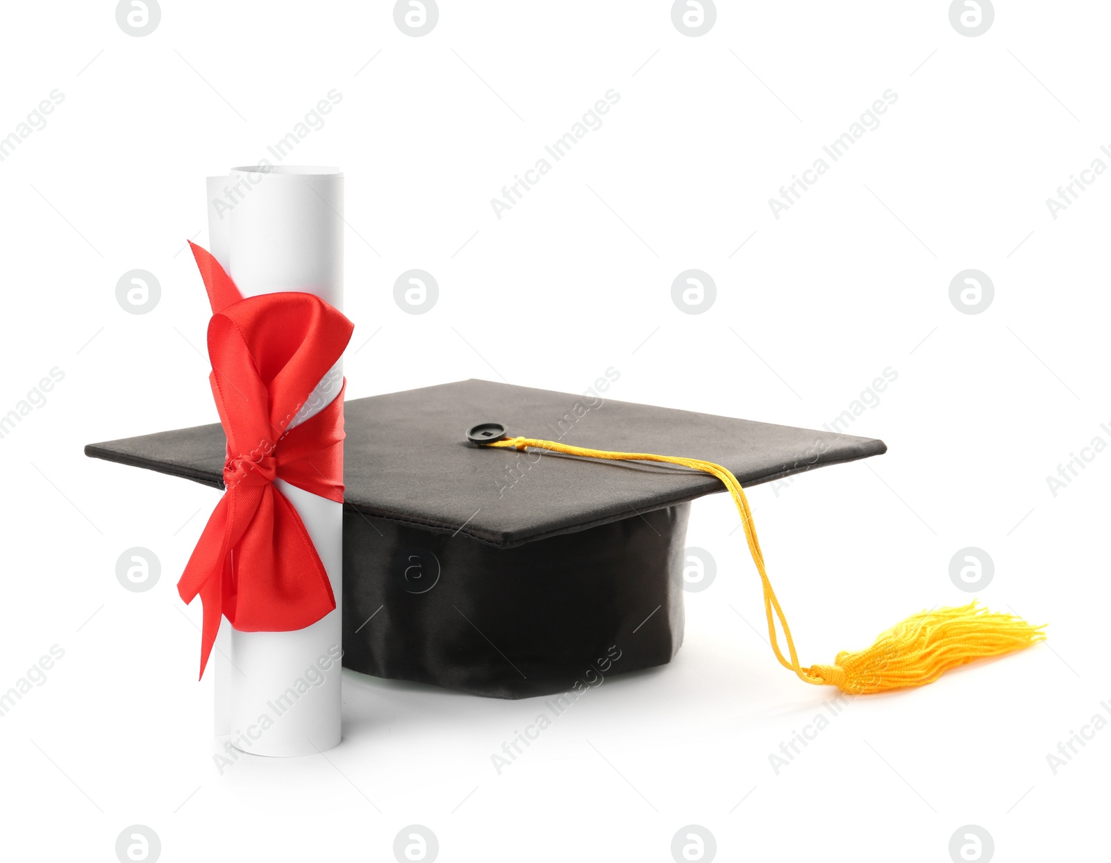 Photo of Graduation hat and diploma on white background