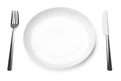 Empty plate and cutlery on white background. Table setting