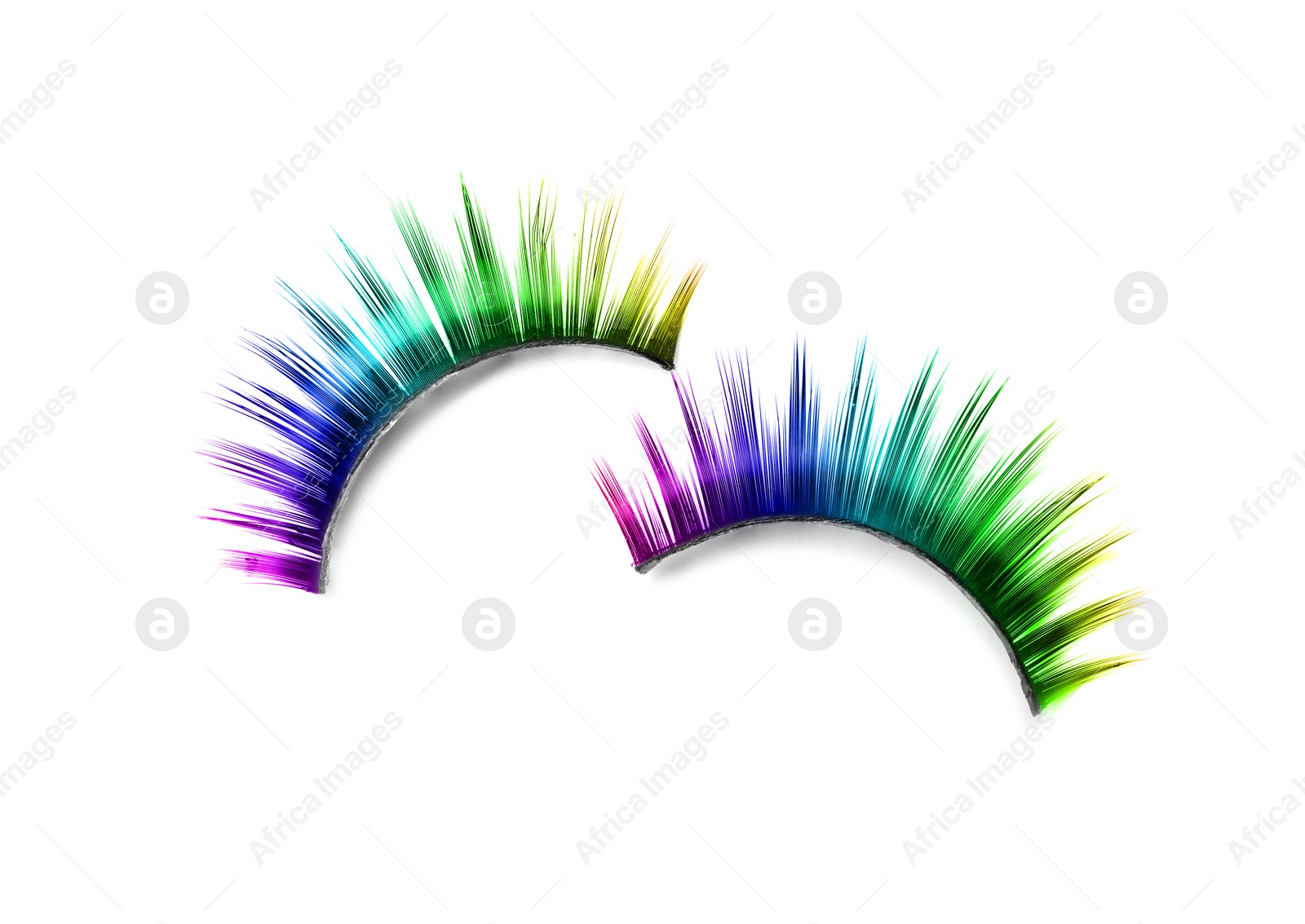 Image of Beautiful pair of color false eyelashes on white background, top view
