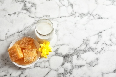 Photo of Beautiful composition with milk and honey on light background